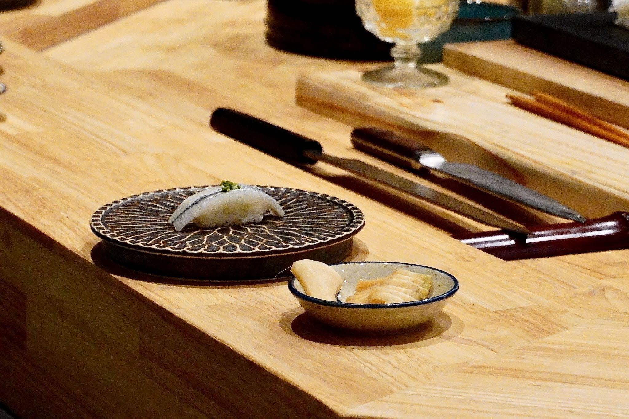 Chef preparing premium nigiri at Sushi Adachi Mountain View